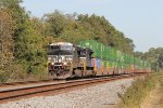 NS 4015 takes a train past MP 143.5